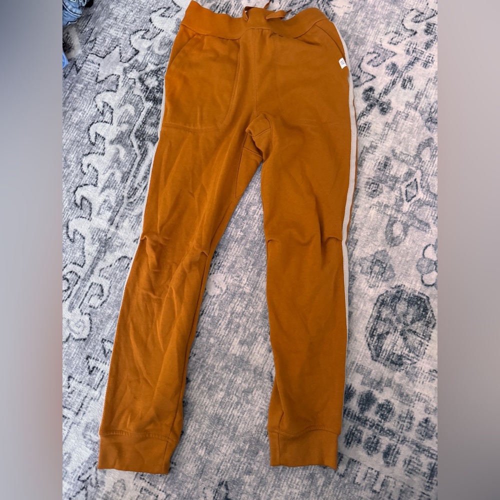 Orange gap sweatpants with stripes down the sides